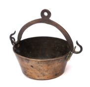 A 19th Century brass cream pail: of circular tapering form with swing handle and ring attached, 9.