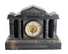A late 19th/early 20th century slate mantel clock: the eight day gong strike movement in an