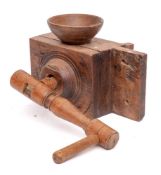 A 19th Century French fruitwood grain mill: with grinding handle and bowl surmount, 34cm long.