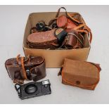 A collection of various cameras and binoculars: various formats including an Olympus XA 2 camera