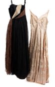 An early 20th century handmade silk evening dress with high bust line and floral embroidered
