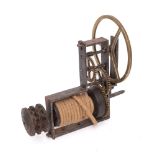 A French steel and brass spit jack: with triple brass wheels gripping the rope driven pulley.