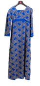 A late 20th century blue silk and gilt embroidered evening dress with rounded neckline,