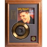 Elvis Presley. A gold plated 45rpm single 'It's Now or Never'; framed and glazed, 40 x 29cm.