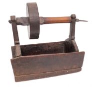 A rare wood toasting dog:, with single iron prong, turned wheel and rectangular trough,