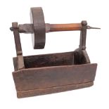 A rare wood toasting dog:, with single iron prong, turned wheel and rectangular trough,