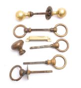 A pair of brass door handles: together with a pair of brass ring door handles,
