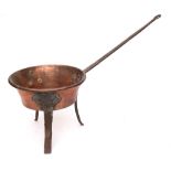 A 19th Century copper and iron mounted saucepan:, the long handle with hook terminal,