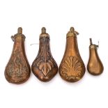 A copper and brass shot flask: by James Dixon & Sons, embossed with hanging game,