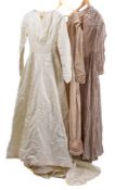 An early 20th century brown silk dress with square neckline, puffed shoulders and slender sleeves,