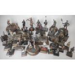 A collection of painted white metal and painted figures and vignettes in various scales from 1/35th