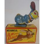 Line MAR Toys, a Japanese clockwork tinplate 'Hopping Rabbit' with lithographed detail, 14cm high,