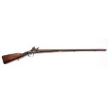 A 19th century double barrel flintlock shotgun,