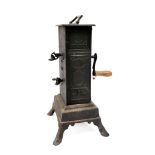 A 19th Century Continental clockwork spit engine: in blackened tin and metal oblong casing,