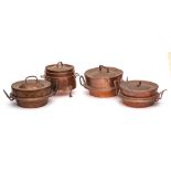 Three copper down-hearth circular cooking pots and covers: and a smaller twin-handled cooking pot