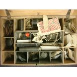 A collection of late 19th century fishing equipment in a pine box,
