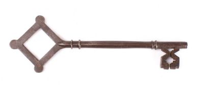 A large 19th century Gothic Revival steel key: the square shaped bow with rounded corners and