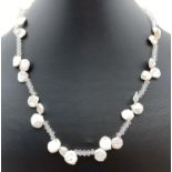 A boxed 18" keshi pearl and faceted glass bead necklace with 925 silver S shaped clasp. Retired