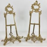 A pair of decorative brass table top easel stands with fold out supporting foot. Each approx. 41cm