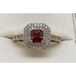 A 14ct gold plated Swarovski crystal set costume jewellery dress ring. Central square cut red