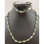 A matching abalone and crystal beaded necklace and bracelet. Necklace approx. 18", with silver