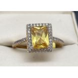 A 14ct gold plated Swarovski crystal set costume jewellery cocktail ring. Central square cut