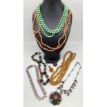 A collection of vintage costume jewellery. To include glass bead drop necklace, diamante and pink