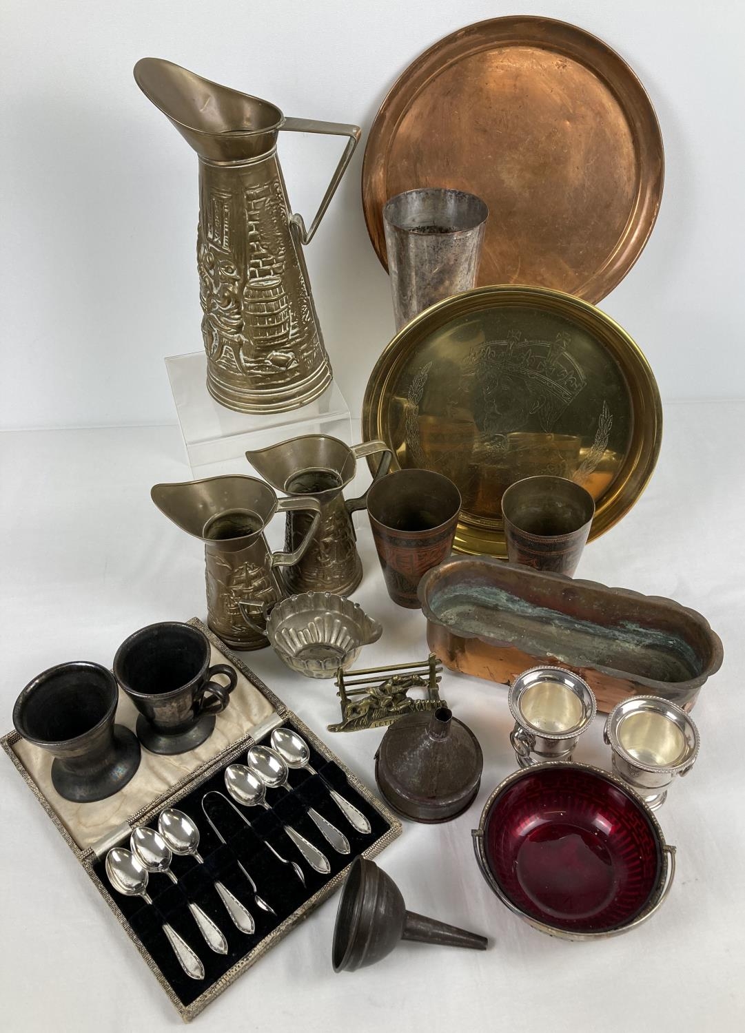 A box of assorted metal ware items. To include small copper planter, brass jugs, funnels, glass