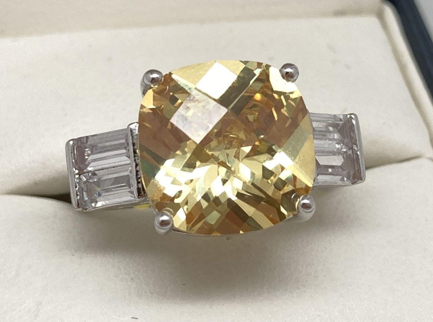 A rhodium plated Swarovski crystal set costume jewellery cocktail ring. Large square cut pale