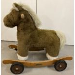 A modern Mamas and Papas Rock and Ride rocking horse. Adjustable wheel fixings to turn into a