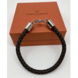 A brand new boxed brown plaited leather and stainless steel men's bracelet by Simon Carter. Approx