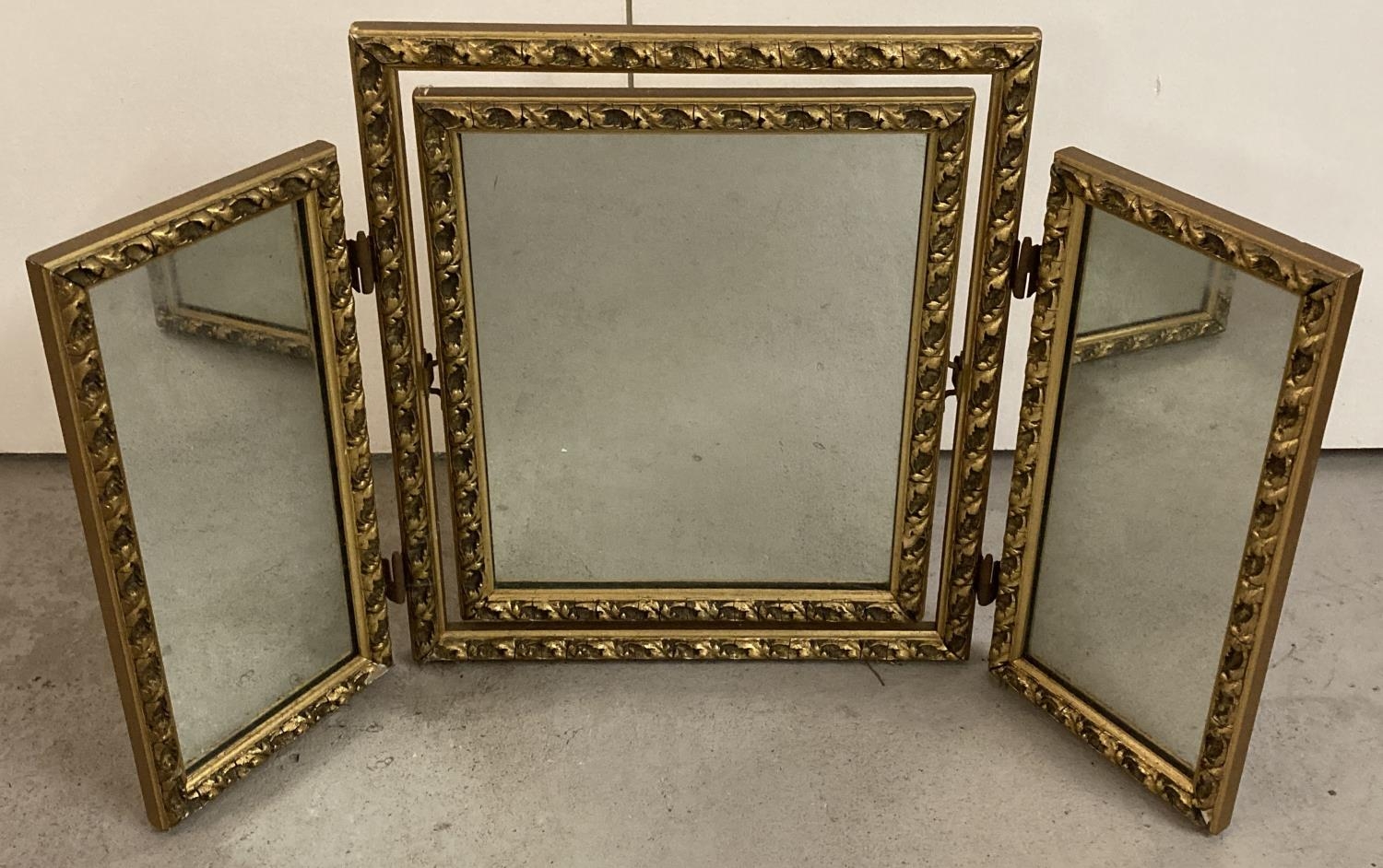 A vintage gilt framed folding triple dressing table mirror, with tilting central glass. Approx. 50cm