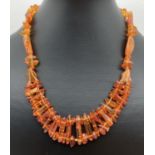 An 18" amber necklace made from varying sized pieces of amber, with screw barrel clasp.