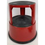 A modern red metal 'Kikalong' safety kick stool with wheels to underside. Approx. 41cm tall.