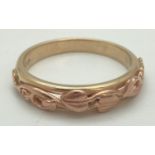 A Welsh Clogau gold 9ct "Tree of Life" split band ring with rose gold overlay detail. Fully