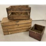3 vintage wooden boxes. To include a pine slatted box with hinged lid and a German advertising
