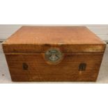 A large vintage Oriental travelling trunk with metal drop handles and clasp. Stitched seams and