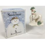 Royal Doulton ceramic snowman figurine "Building The Snowman", DS23. From The Snowman Gift
