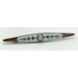 A vintage white metal bar brooch with pale blue enamel, simple floral design and central pearl.
