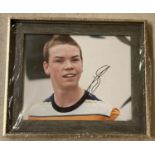 A framed and glazed signed photo of Will Poulter playing "Kenny" in Warner Bros film 2013 "We're The