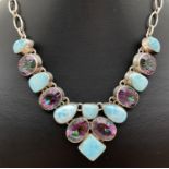 A modern 925 silver articulated link fixed pendant necklace set with mystic topaz. With alternate