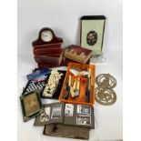 A box of assorted vintage items to include books, cutlery and ephemera. Lot includes: Regent of