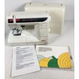 An Elna 3007 Swiss design electric sewing machine, complete with instruction manual. Together with a