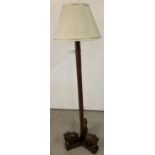 A vintage ethnographic hardwood standard lamp with 3 carved wooden elephant feet. Complete with