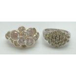 2 modern design cluster style dress rings both set with clear cubic zirconia stones. One ring set