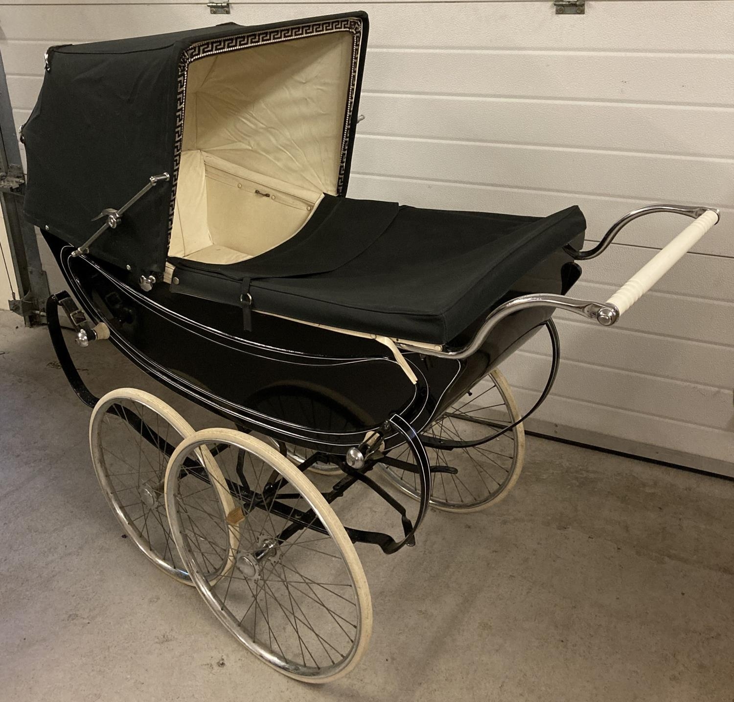 A vintage 1960's Sol Peram coach built pram painted in black & cream. Wooden bodied with cream - Image 2 of 12