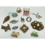 A collection of 15 vintage brooches to include marcasite and stone set examples. Also includes