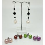 5 pairs of silver freshwater pearl earrings, 4 stud style and 1 drop style. Studs in green,