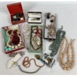 A collection of assorted vintage costume jewellery and watches. To include: plastic beads, clip-on