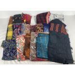A collection of 20 modern pashmina style scarves in a variety of prints and styles.